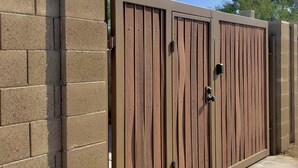A gated entrance with a metal gate and a brick wall. - 🏜Urban Desert Retreat for the Adventurous Traveler Snow Free-Stay with us! ☀️🐾 (Tempe)