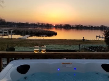 View from within the optional hot tub amenity on the back deck looking out into the bay in spring.