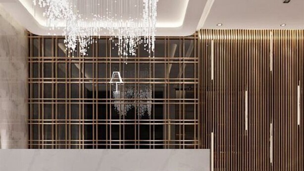A modern interior with a reception desk, a large window with a grid pattern, and a decorative light fixture. - Art Coffee Hotel (Shenzhen)