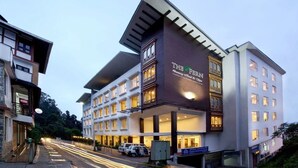 A hotel with multiple floors, a prominent entrance, and a sign indicating it is a business hotel. - The Fern Denzong Hotel & Spa Gangtok (Gangtok)