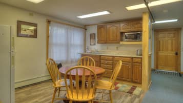Fridge, microwave, coffee/tea maker, cookware/dishes/utensils