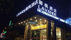 A hotel named "LAVANDE" with a modern facade and illuminated signage. - Lavande Hotel Shanghai Zhangjiang Guanglan Road Me (Shanghai)