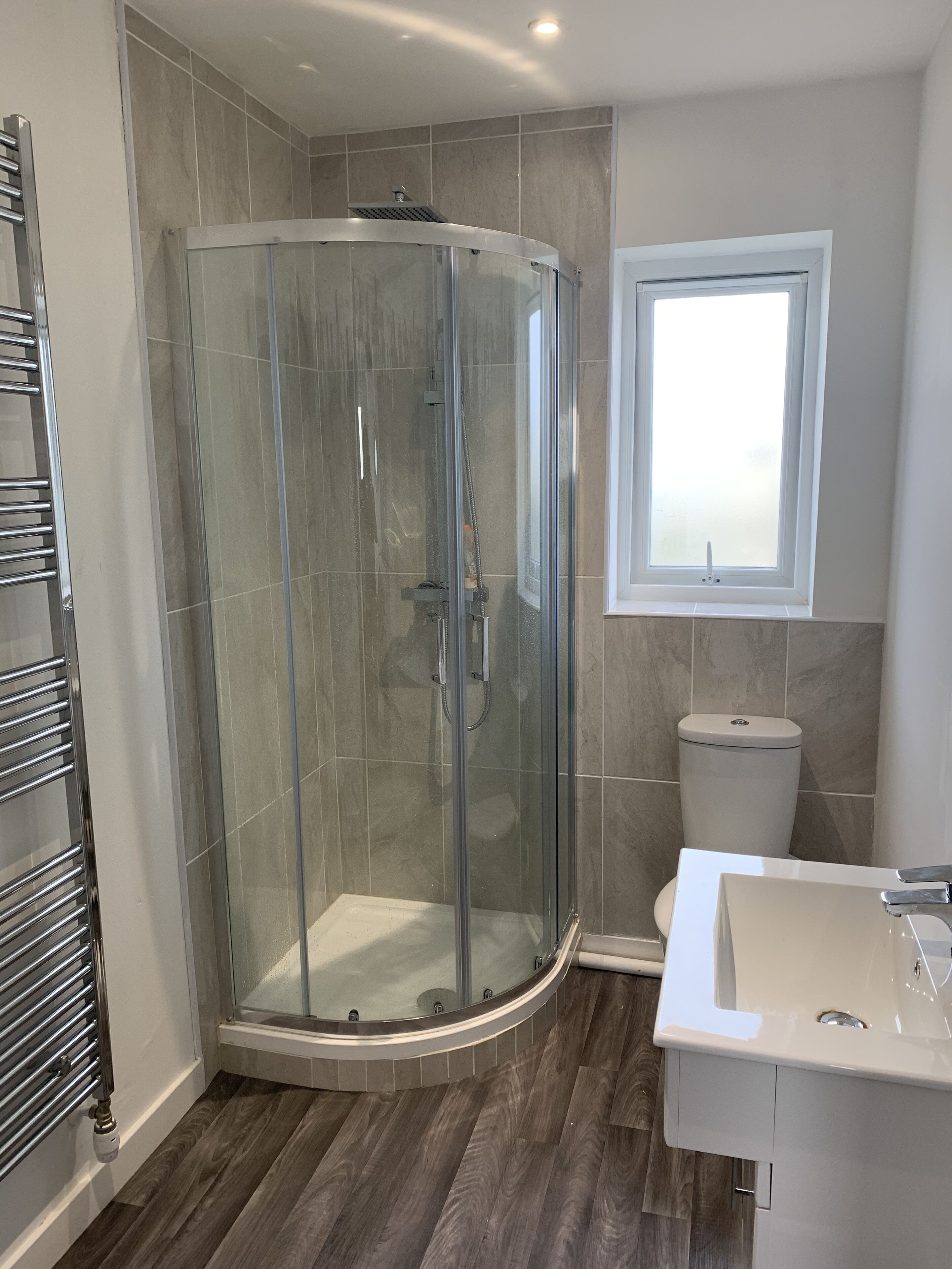 Shower, hair dryer, towels, toilet paper