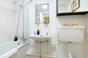 Combined shower/bathtub, hair dryer, towels, soap