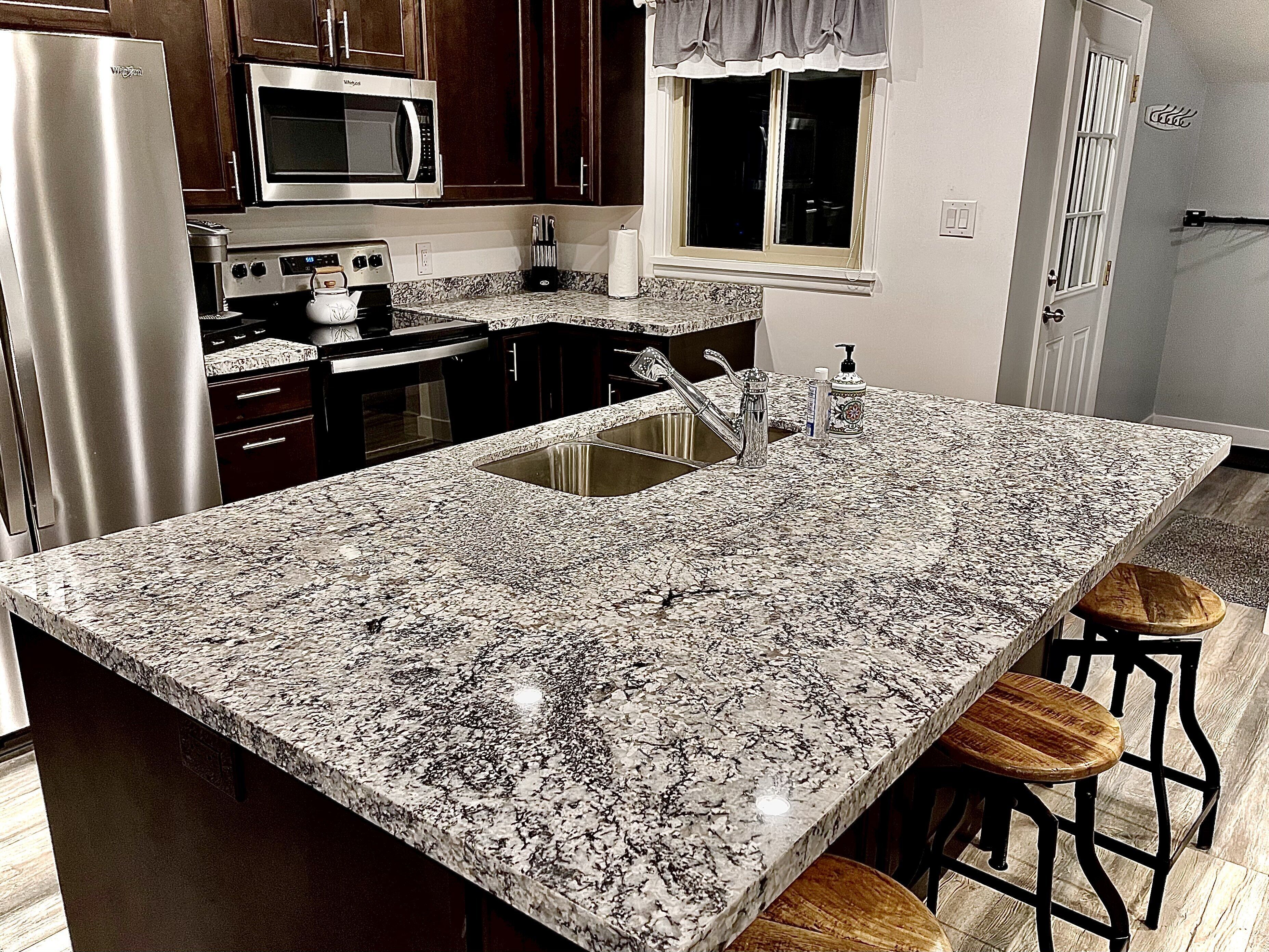 Microwave, dishwasher, coffee/tea maker, cookware/dishes/utensils