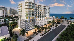 A multi-story hotel with balconies, a pool area, and a view of the ocean. - AC Hotel by Marriott Fort Lauderdale Beach (Fort Lauderdale)