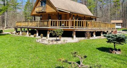 secluded log home, minutes from all star village in Oneonta