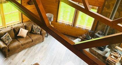 secluded log home, minutes from all star village in Oneonta