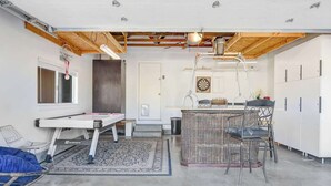 A compact living space with a pool table, a bar area, and a dining table. - Sonoma Valley Vacation Home (Santa Rosa)