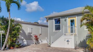 Stylish two-story residence with a modern design and a welcoming front porch.