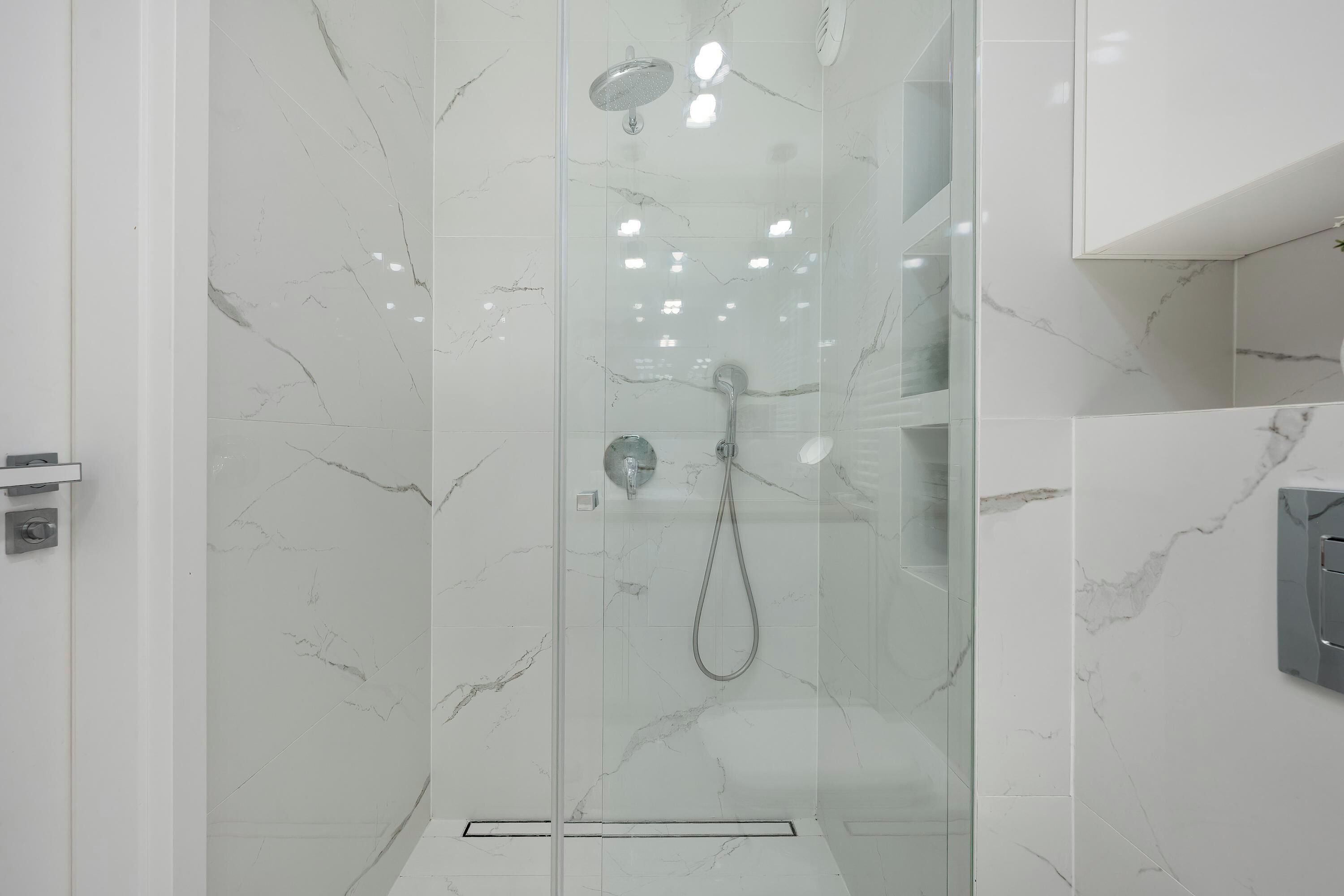 Shower, hair dryer, towels, shampoo