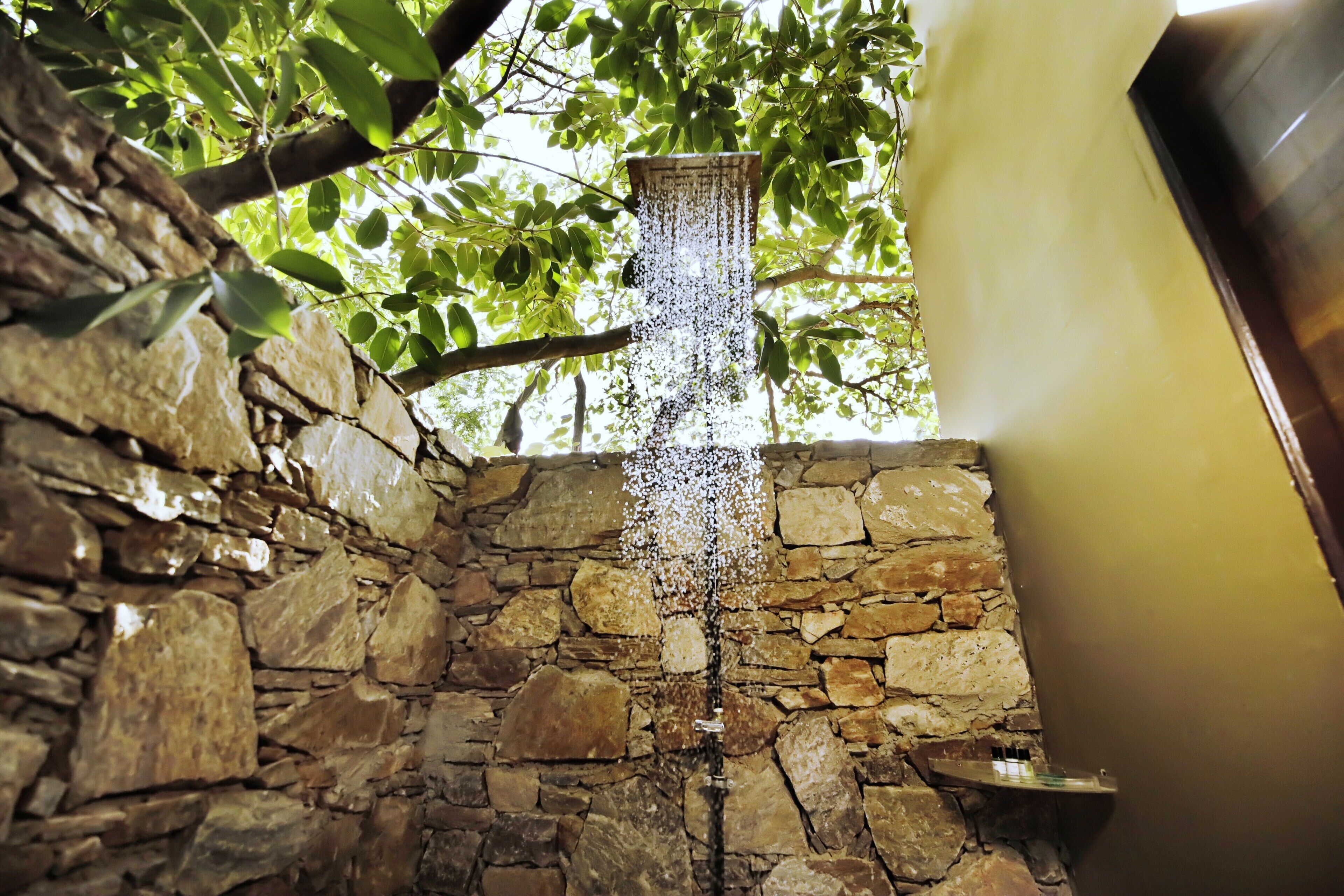 A stone wall with a water feature.