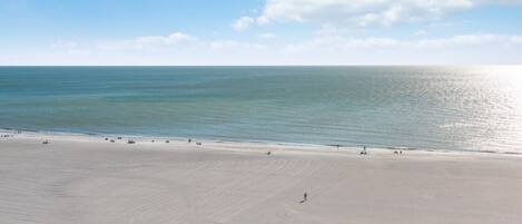 On the beach, sun-loungers, beach towels