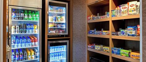 A vending machine area with various snacks and drinks.