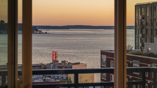 A view of a body of water with buildings in the foreground. - Cozy Belltown Condo with amazing Elliott Bay Views (Seattle)