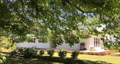 Large country homestead with tennis court and pool. Only 5 mins from the beach.
