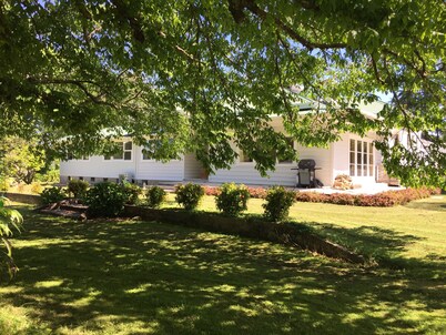 Large country homestead with tennis court and pool. Only 5 mins from the beach.