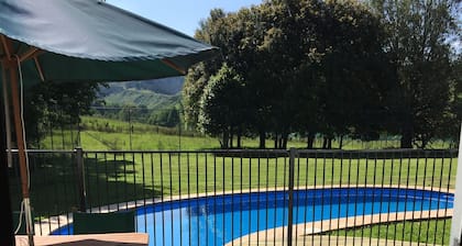 Large country homestead with tennis court and pool. Only 5 mins from the beach.
