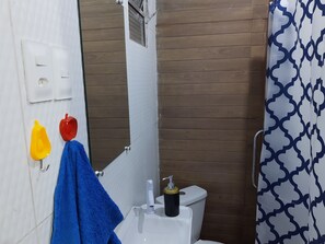 Shower, hair dryer, towels, toilet paper