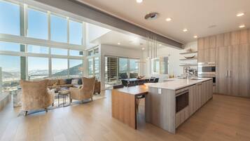 Luxury Townhome | Private kitchen | Full-size fridge, microwave, oven, stovetop