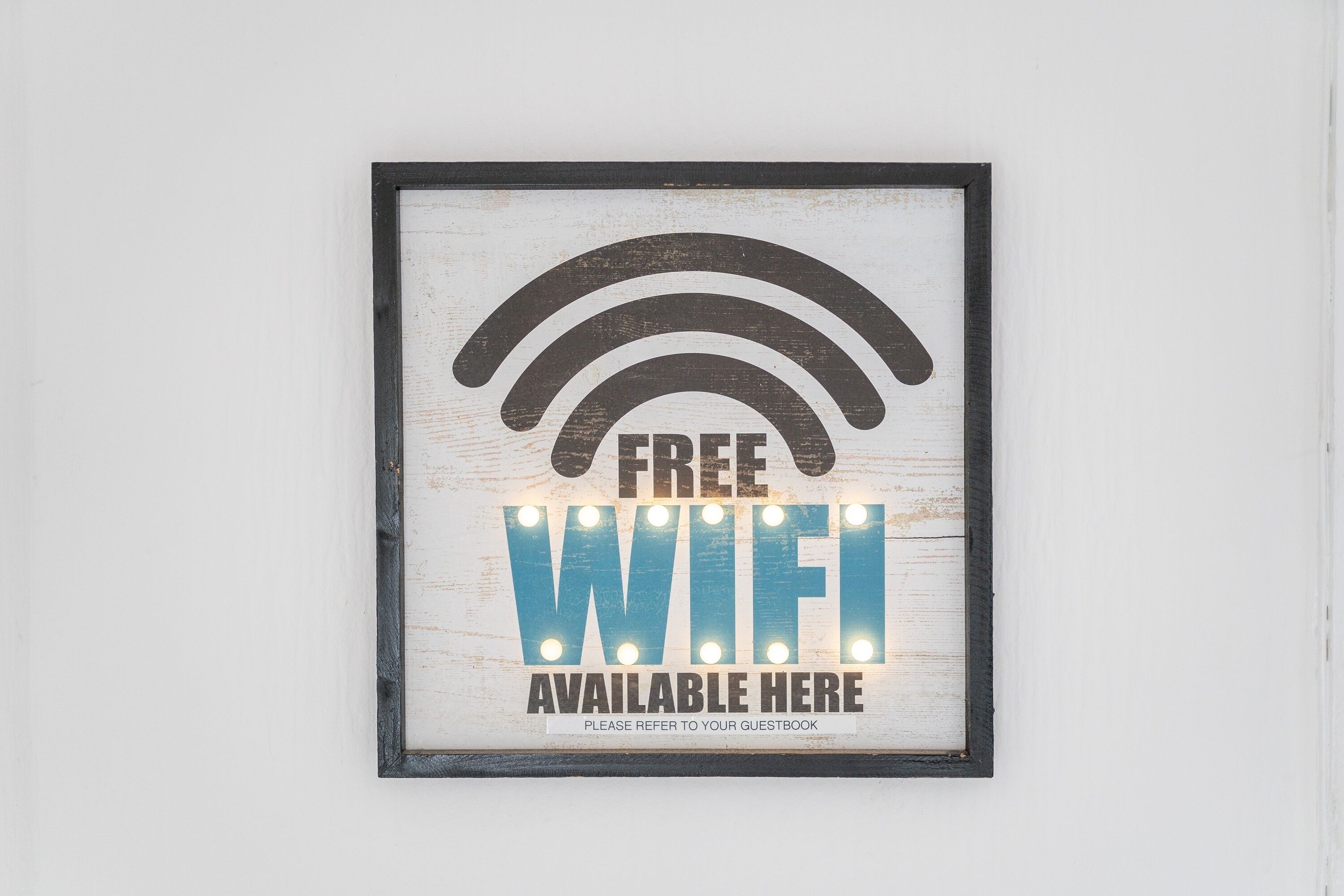 A framed sign indicating free WiFi availability.