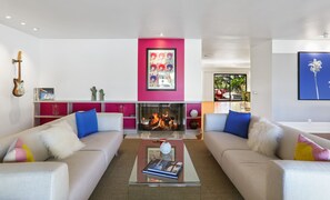 Smart TV, fireplace, books, offices