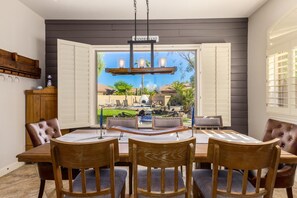 Enjoy meals in this stylish dining area with a large oval-shaped table and six comfortable chairs.