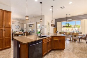 Enjoy meal preparation at the large island with dishwasher and ample counter space.