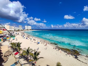 On the beach, sun loungers, beach towels