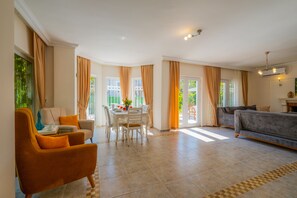 Deluxe Villa | Living area | LCD TV, fireplace