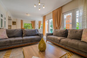 Deluxe Villa | Living room | LCD TV, fireplace