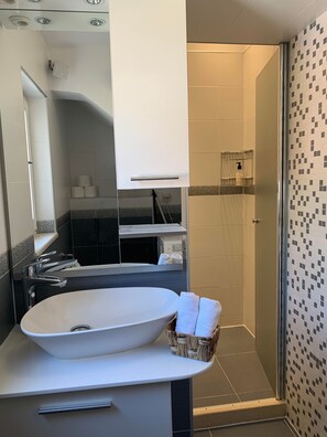 Shower, hair dryer, towels, soap