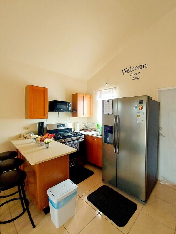 Fridge, microwave, toaster, cookware/dishes/utensils