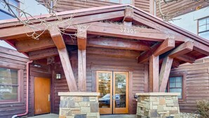 A wooden building with a stone entrance and a number '37305' above the door. - 1-brookside 307 (Avon)