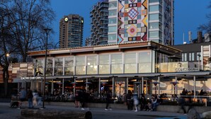 A modern building with a glass facade, a visible sign for 'Cactus Club Cafe,' and a 'Concession' sign. - Revival English Bay, Vancouver  (Vancouver)