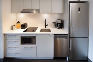 Suite, 2 Queen Beds, Balcony | Private kitchen | Fridge, microwave, stovetop, coffee/tea maker