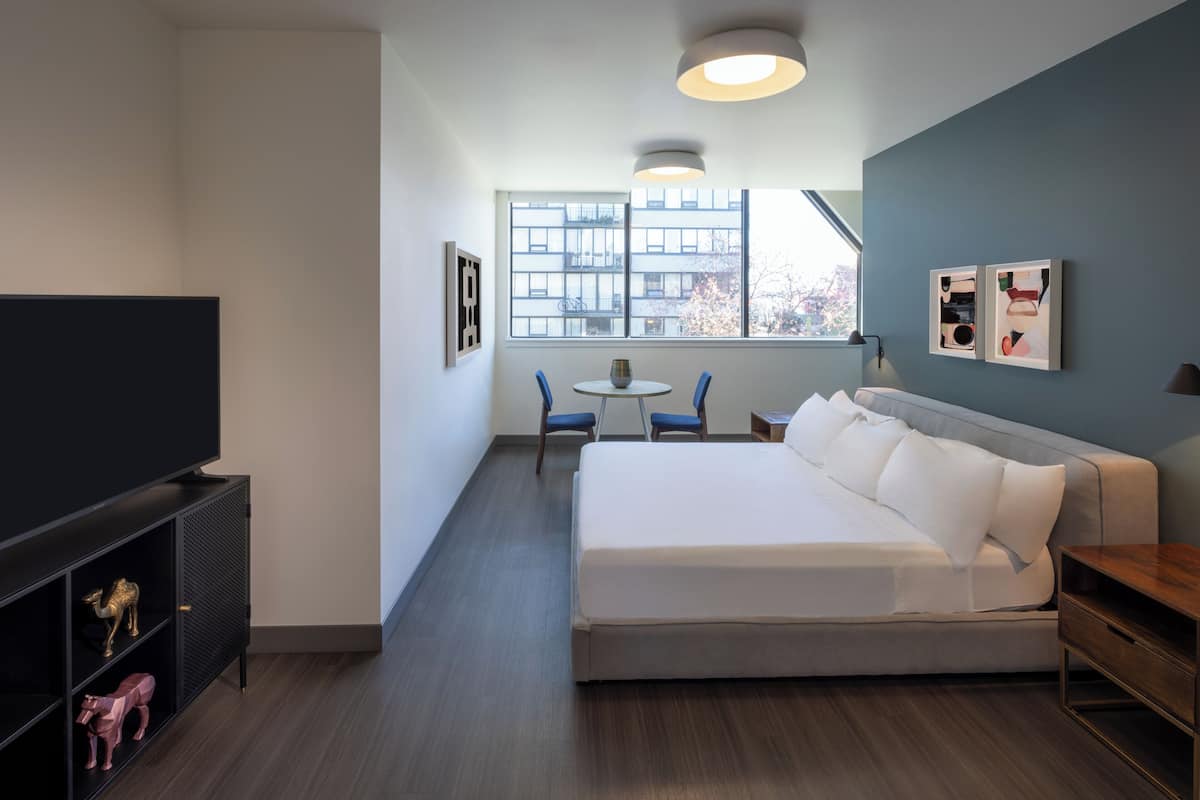 Suite, 1 King Bed, Non Smoking | Individually furnished, iron/ironing board, bed sheets