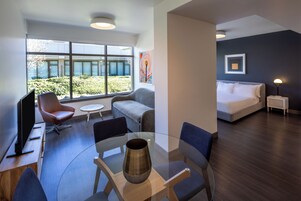 Suite, 1 King Bed with Sofa bed, Kitchen, Courtyard View | Living area | 40-inch flat-screen TV with digital channels, TV