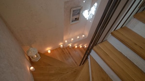 A wooden staircase with a row of candles along the wall. - Luxury Villa Bol Oasis Brac With Heated Pool (Bol)