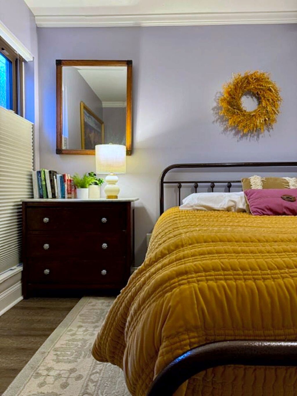 Bedroom with dresser, mirror and queen bed