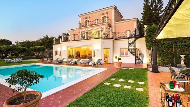 A two-story house with a swimming pool, outdoor seating, and a staircase. - Villa Stellare, with private pool and sea views (Capo d'Orlando)