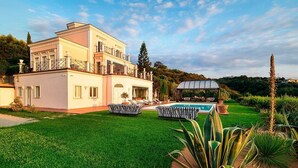 A large, two-story house with a swimming pool, a covered patio, and a well-maintained lawn. - Villa Stellare, with private pool and sea views (Capo d'Orlando)