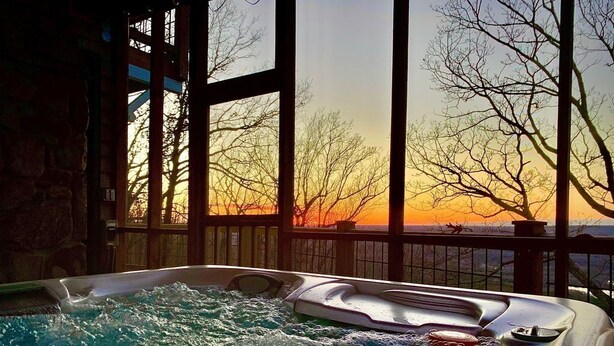 A hot tub with a view of a sunset through large windows. - Majestic Views, Romantic Brow Home 1.5 Miles From The Heart Of Mentone (Mentone)