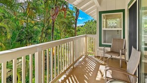A balcony with a white railing, a window, and two chairs. - Regency at Poipu Kai #621 By Parrish Kauai - premier condo with central air grea (Koloa)