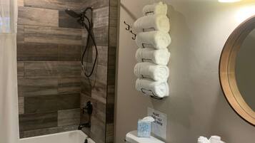 Combined shower/tub, hair dryer, towels, soap