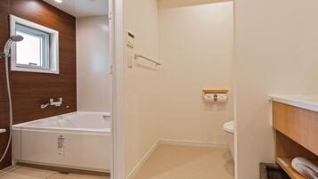 Separate tub and shower, free toiletries, hair dryer, slippers