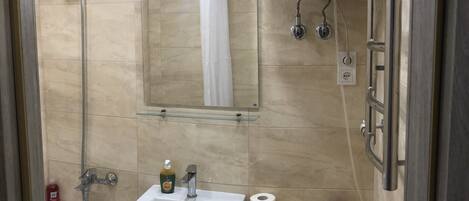 Comfort Apartment | Bathroom | Hair dryer, slippers, towels, soap