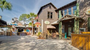 A wooden building with a sign for 'Crazy Lobster' and a 'Village Door' sign.