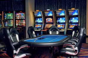 A casino with multiple slot machines and a pool table. - Paris (Opatija)