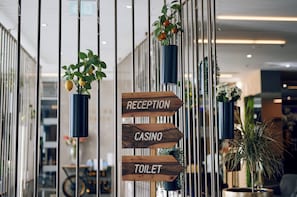 A reception sign with directional arrows pointing to reception, casino, and toilet. - Paris (Opatija)